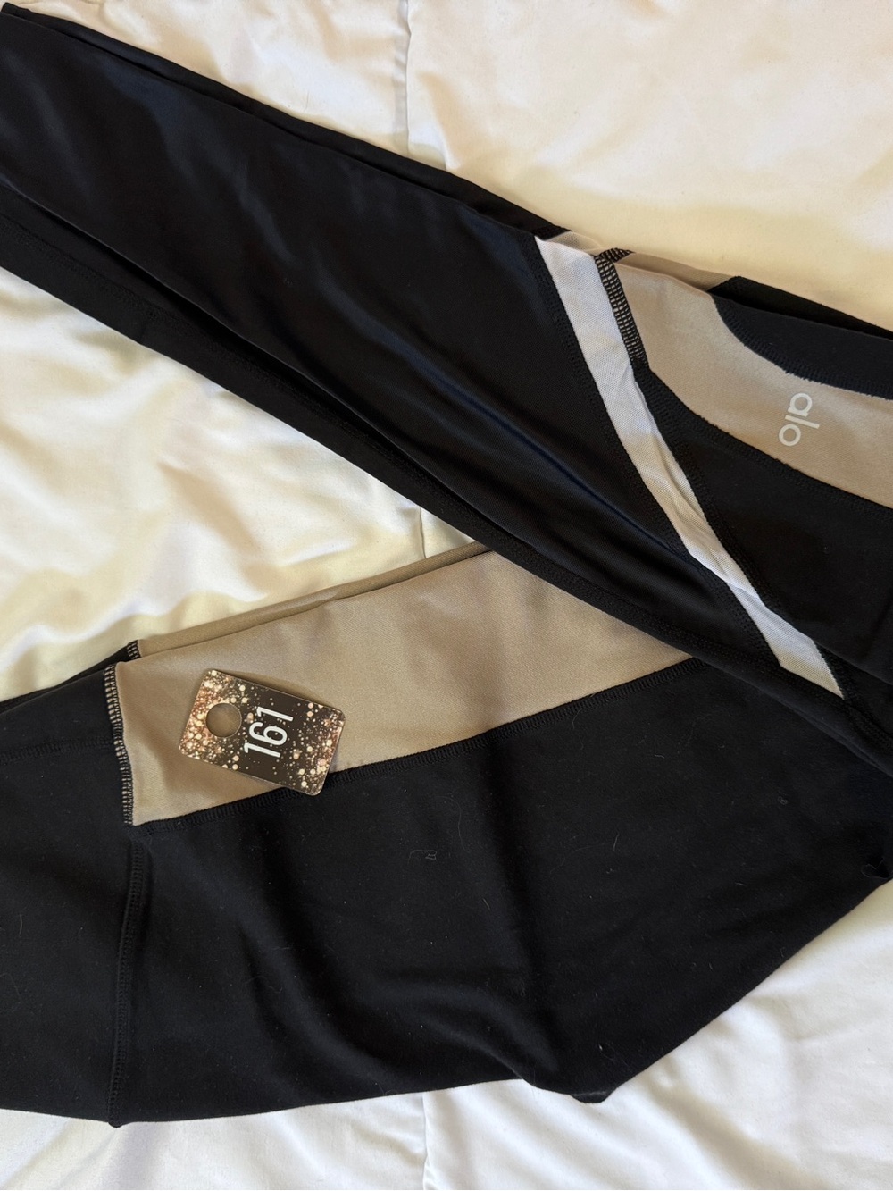161 ALO Yoga Elevate Leggings in black and tan